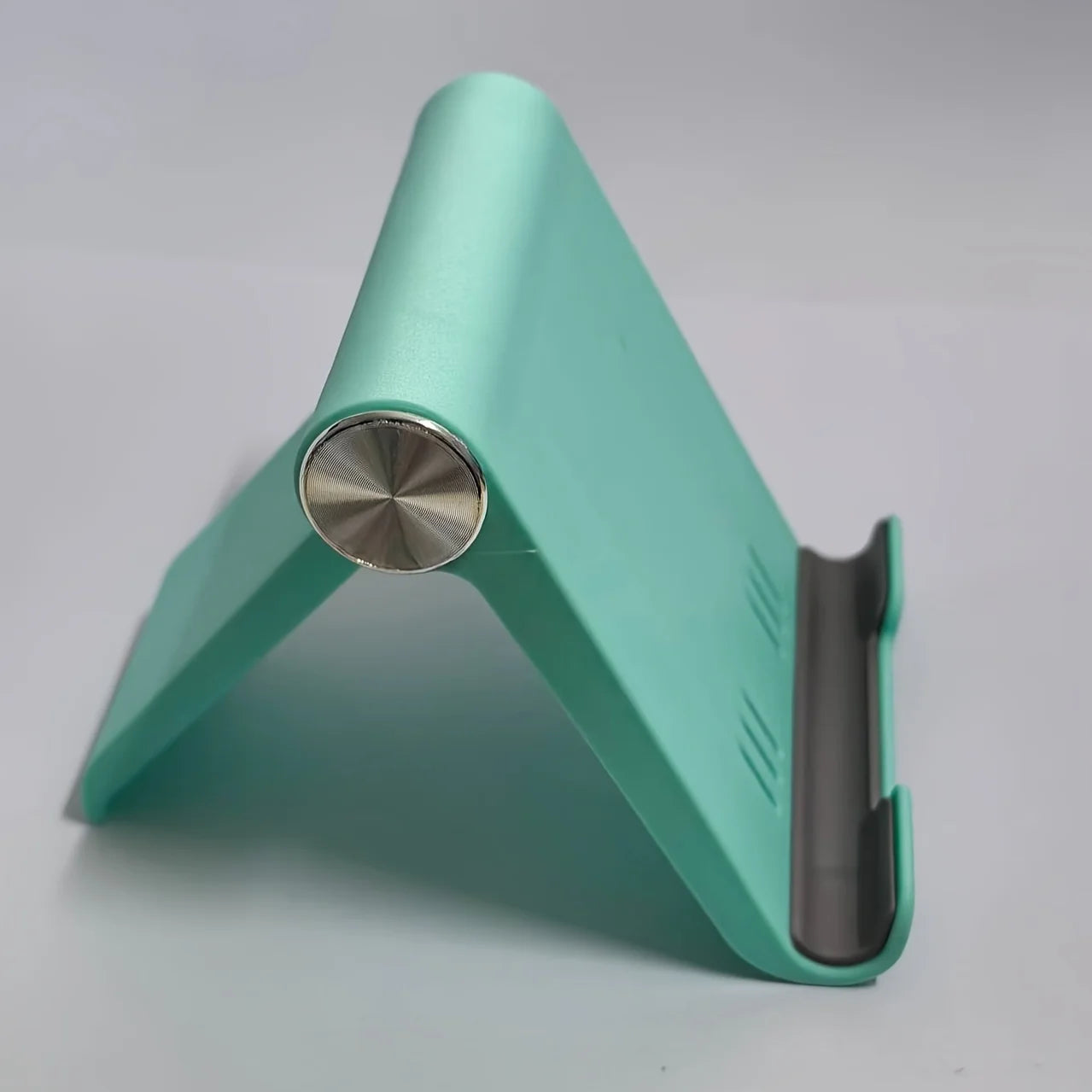 Portable Foldable Phone Stand, Adjustable Angle, Durable Plastic, Universal for Smartphones , Compact Modern Design.